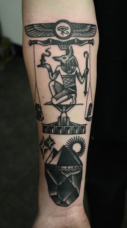 Egyptian god anubis tattoo by Philip Yarnell