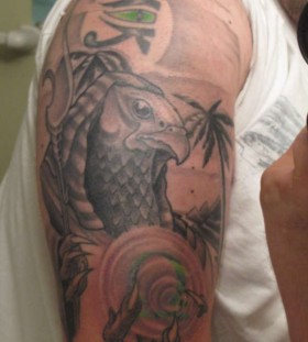 Egyptian god horus arm tattoo
