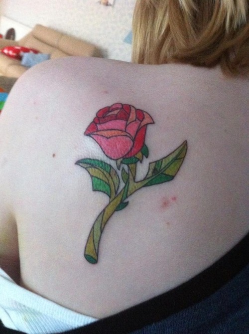 Enchanted rose back tattoo