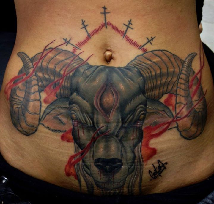 Evil goat stomach tattoo