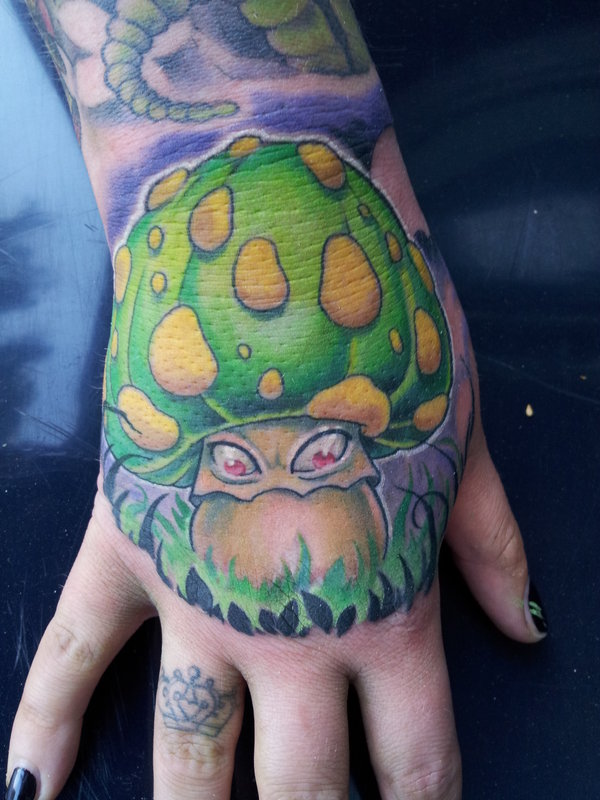 Evil mushroom hand tattoo