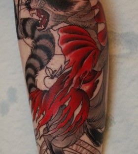 Evil raccoon arm tattoo
