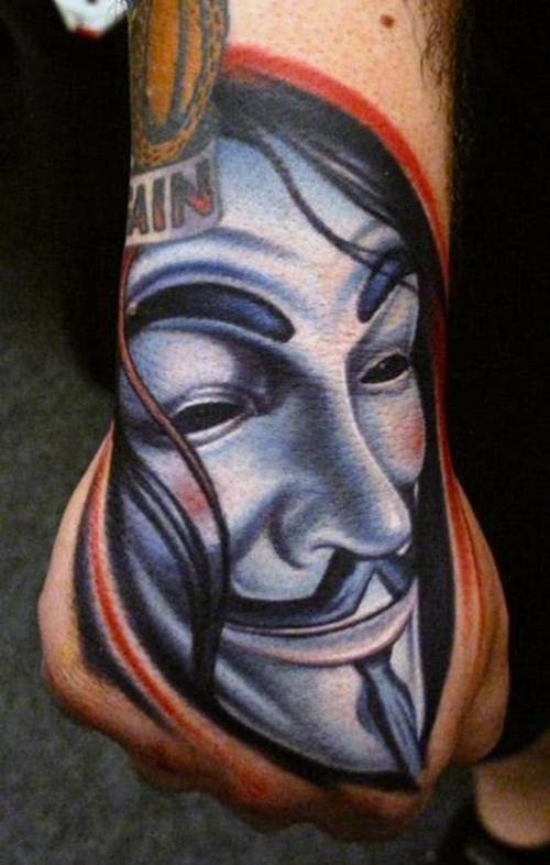 Face of V hand tattoo