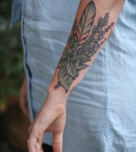 Feather and herb tattoo by Kirsten Holliday