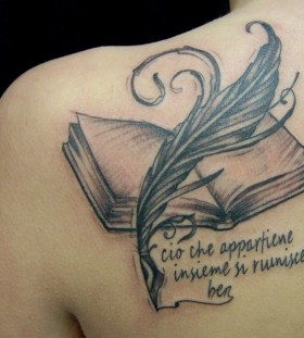 Feather pen and book tattoo