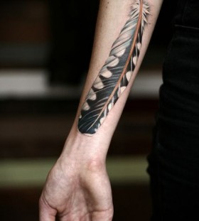 Feather tattoo on arm by Alice Kendall