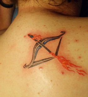 Flaming arrow and bow tattoo