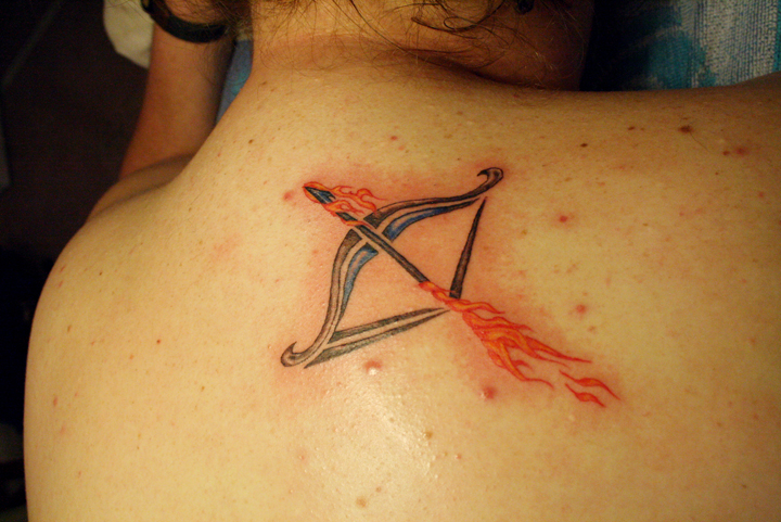 Flaming arrow and bow tattoo