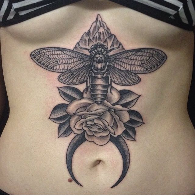 Flower and insect tattoo