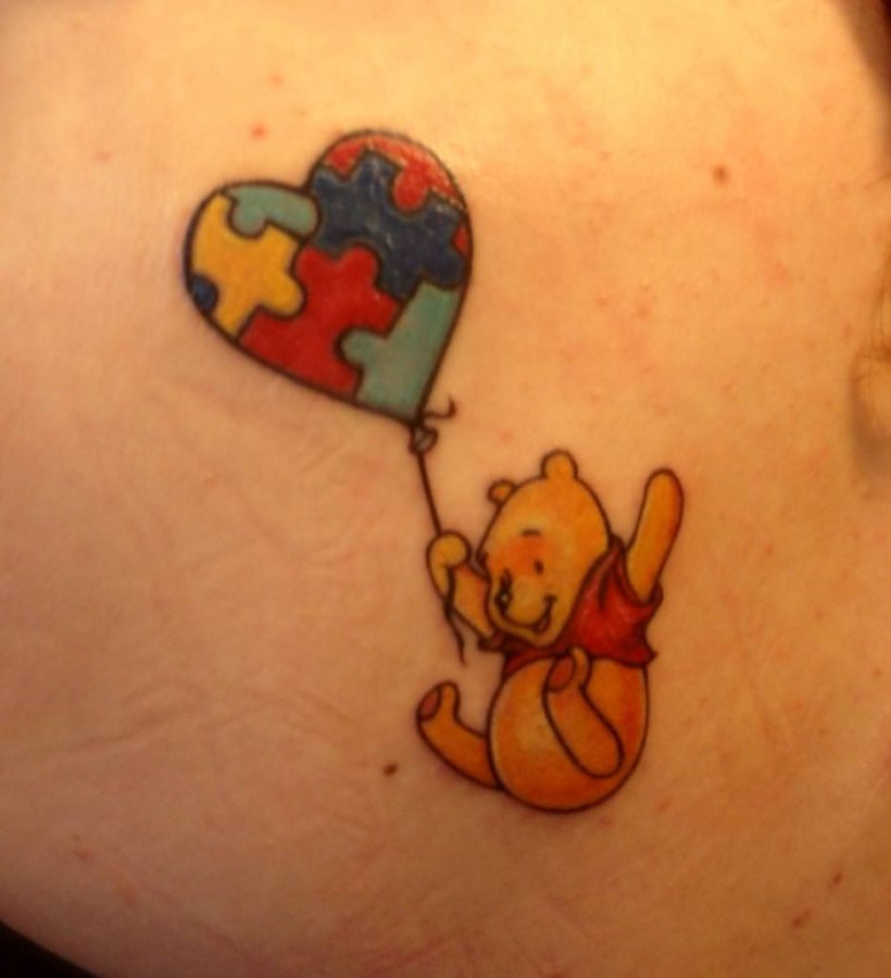 Flying winnie with a balloon tattoo