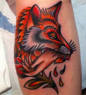 Fox bitting hand tattoo by Nick Oaks