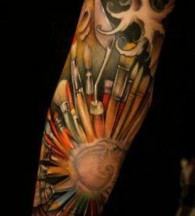 Full arm paint brush tattoo