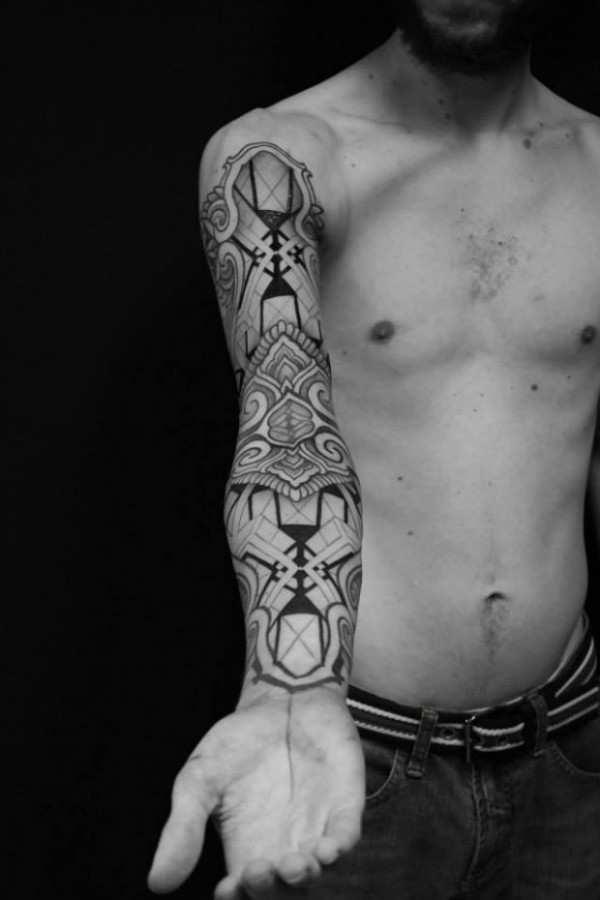 Full arm tattoo by Brian Gomes