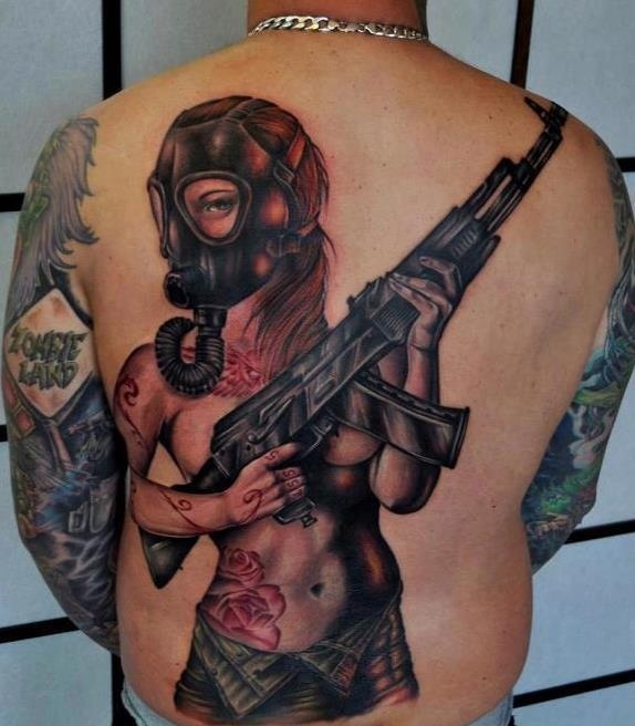 Girl with a gun tattoo by Benjamin Laukis