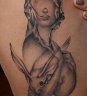 Girl with a rabbit tattoo