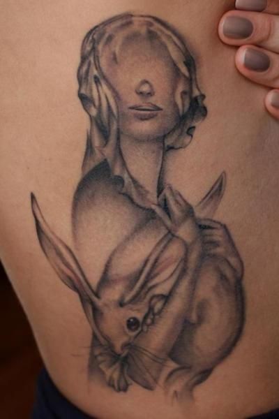 Girl with a rabbit tattoo