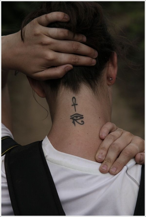 Girl’s neck egyptian eye tattoo