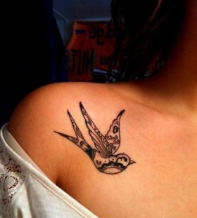 Girl's shoulder black tribal bird tattoo