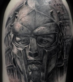 Gladiator's face arm tattoo