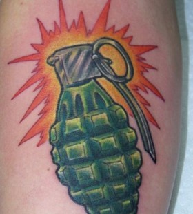 Glowing hand grenade tattoo