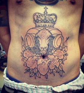 Goat and flowers stomach tattoo