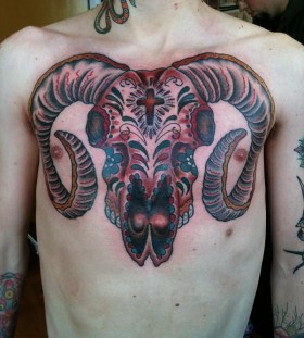 Goat skull chest tattoo