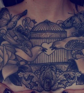 Gorgeous birdcage chest tattoo