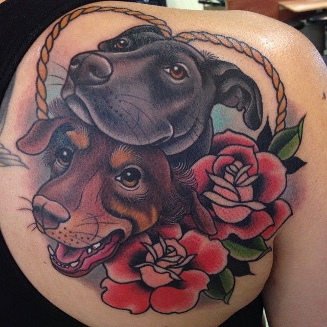 Gorgeous looking red rose and dog’s tattoo