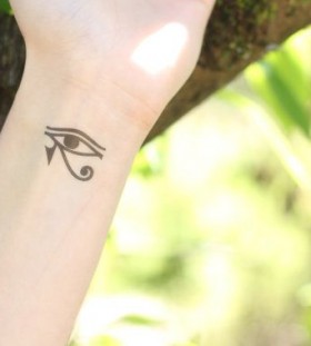 Green background egyptian eye tattoo