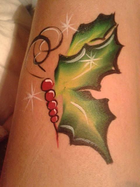 Green leafs christmas tattoo