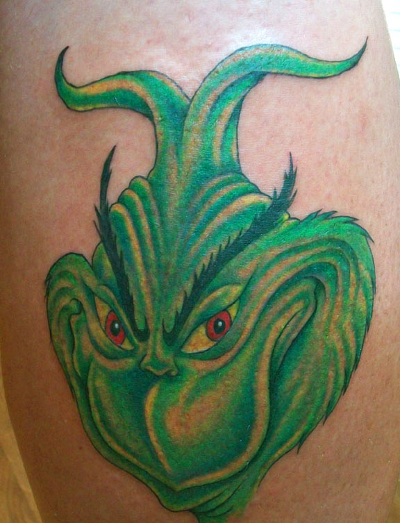 Green lovely looking grinch christmas tattoo