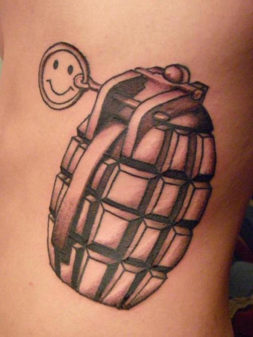 Grenade with smiley face tattoo