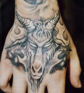 Grey ink goat hand tattoo