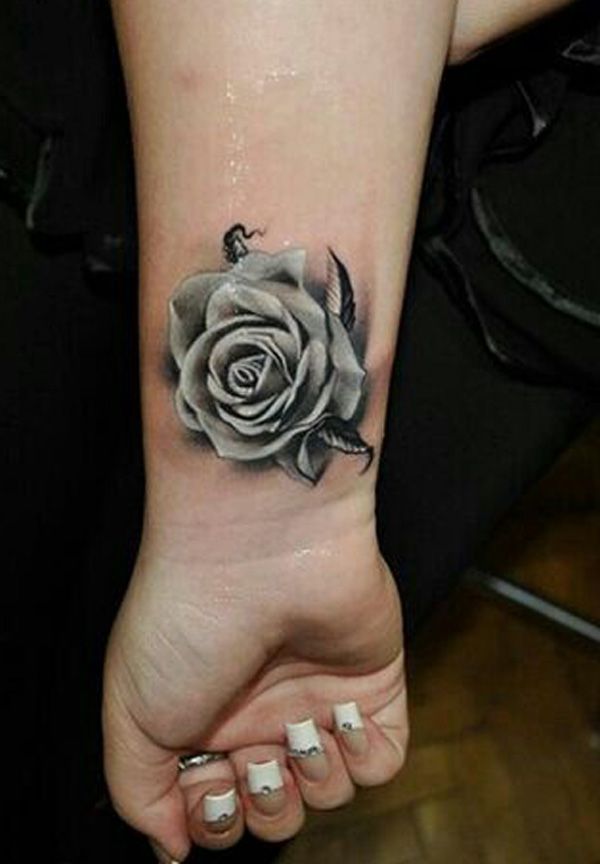 Grey rose wrist tattoo