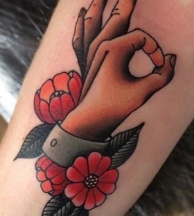 Hand and flowers tattoo by Amanda Leadman