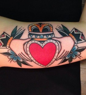 Heart and hands tattoo by Nick Oaks