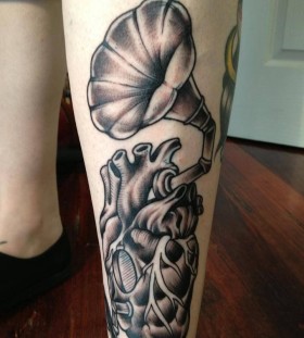 Heart gramophone leg tattoo