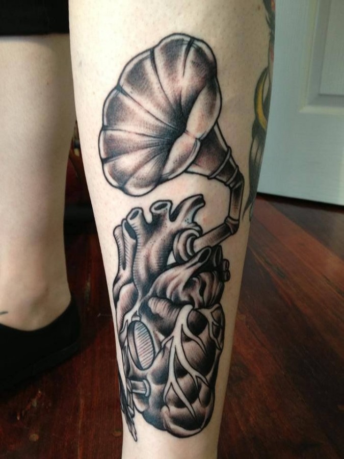 Heart gramophone leg tattoo