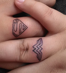 His and hers superchero couples tattoo