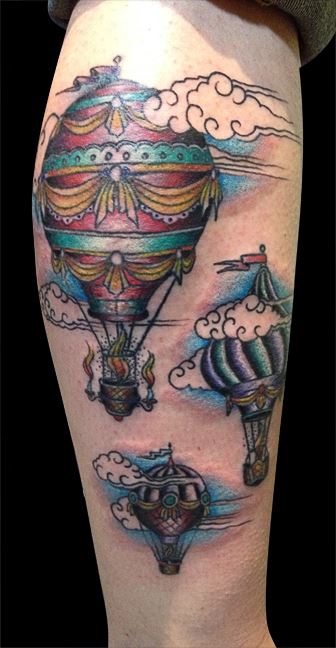 Hot air balloons arm tattoo