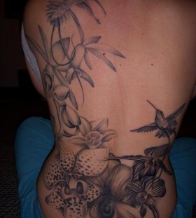 Hummingbirds and orchids tattoo by Amanda Leadman