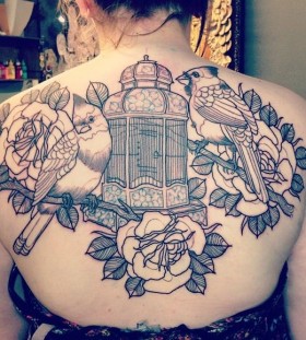 Incredible birdcage back tattoo