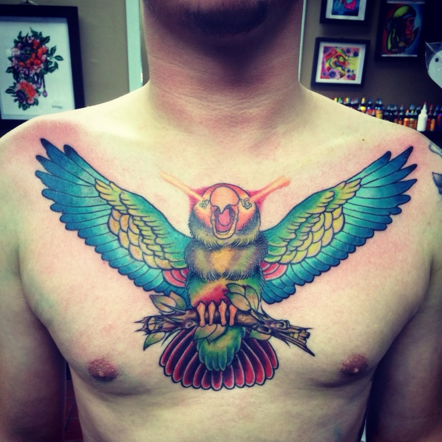 Incredible parrot chest tattoo