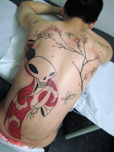 Incredible skeleton back tattoo by Yann Black