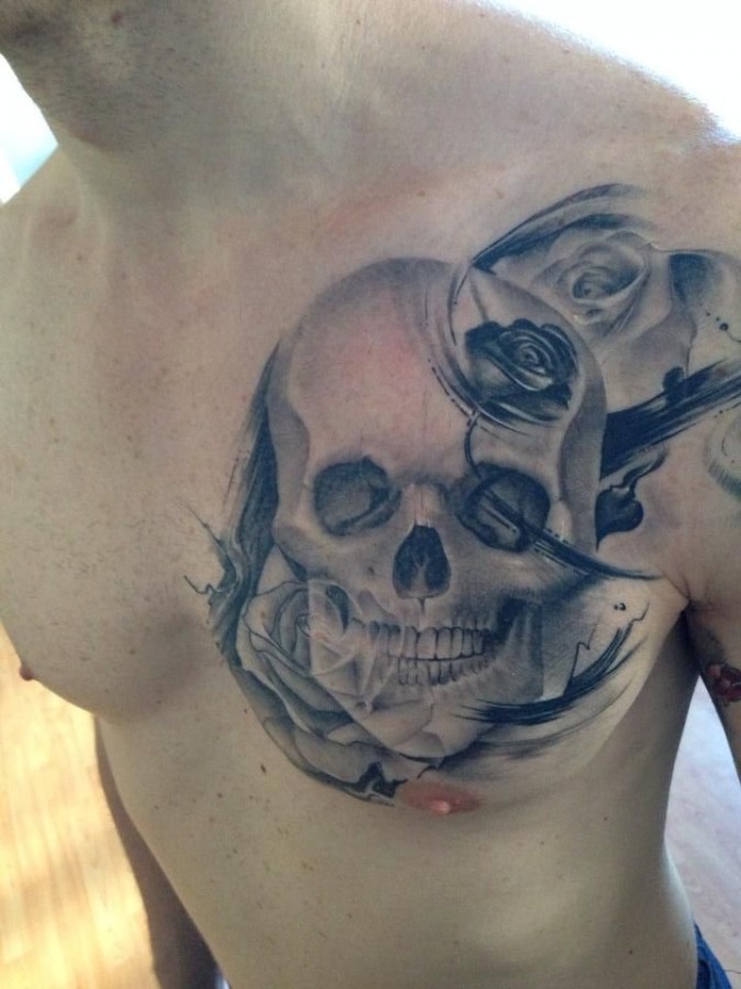 Incredible skull chest tattoo by Razvan Popescu