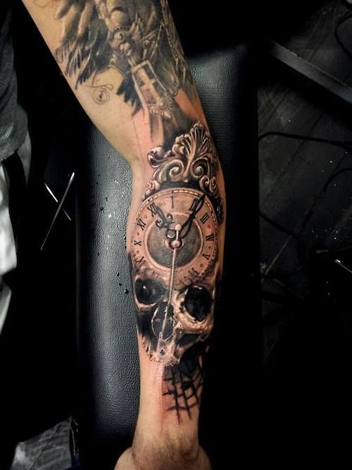 Incredible skull clock arm tattoo