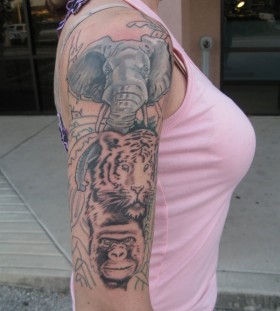 Jungle animals arm tattoo