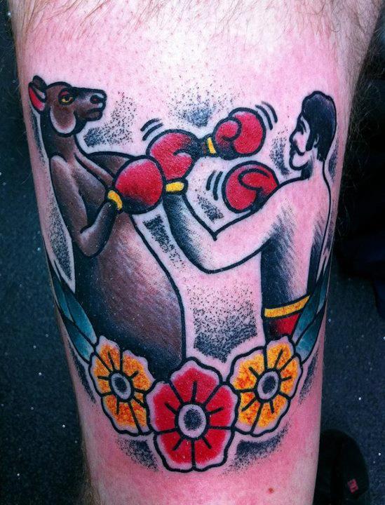 Kangaroo boxing against a man tattoo