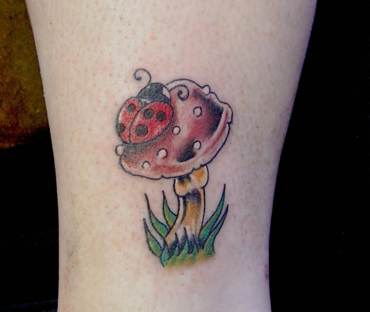 Ladybug and mushroom tattoo