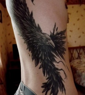 Large raven side tattoo